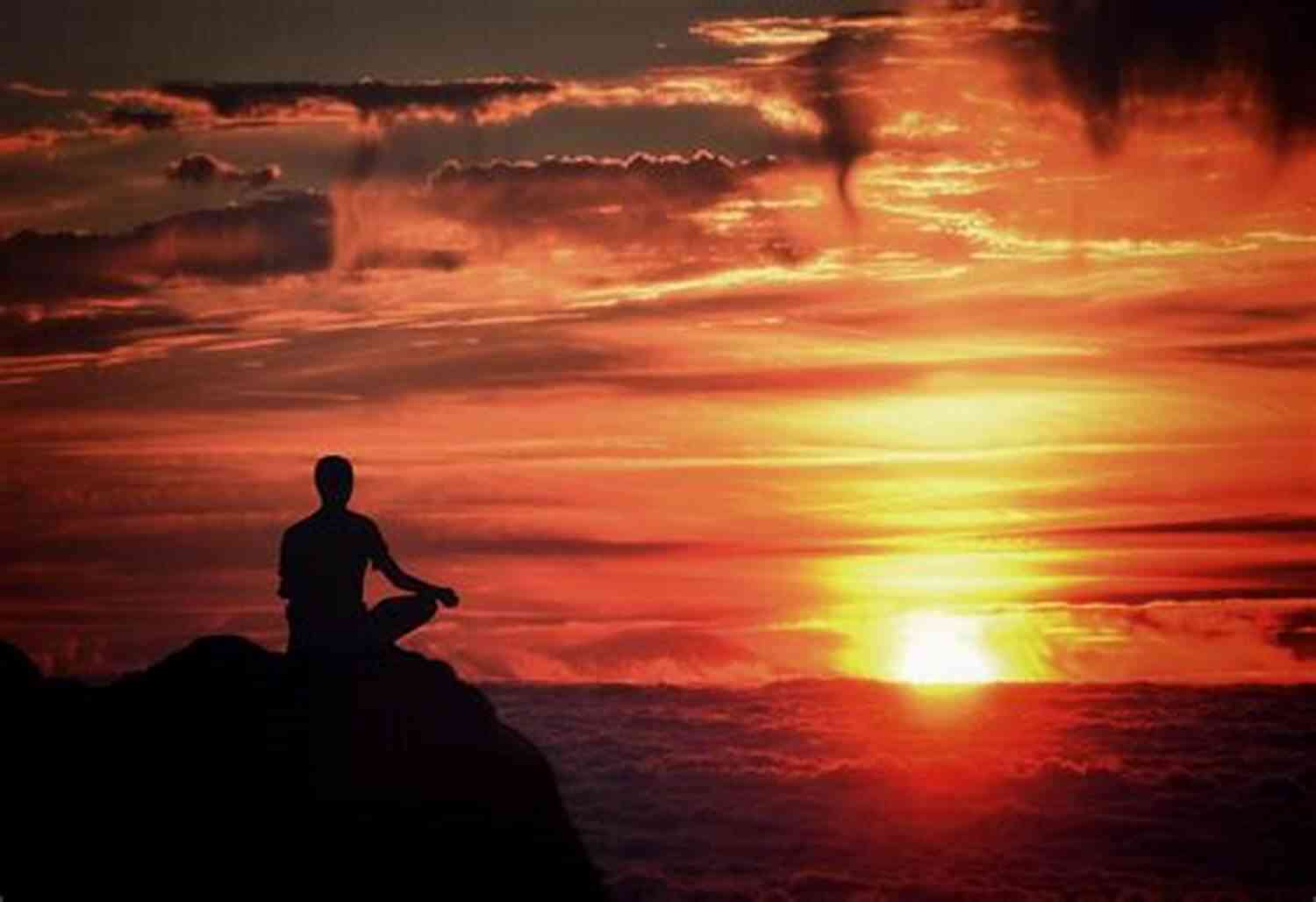 A Person Meditating Near A Calm Lake With Beautiful Sunset This Is How To Manifest The Life You Want: Law Of Attraction