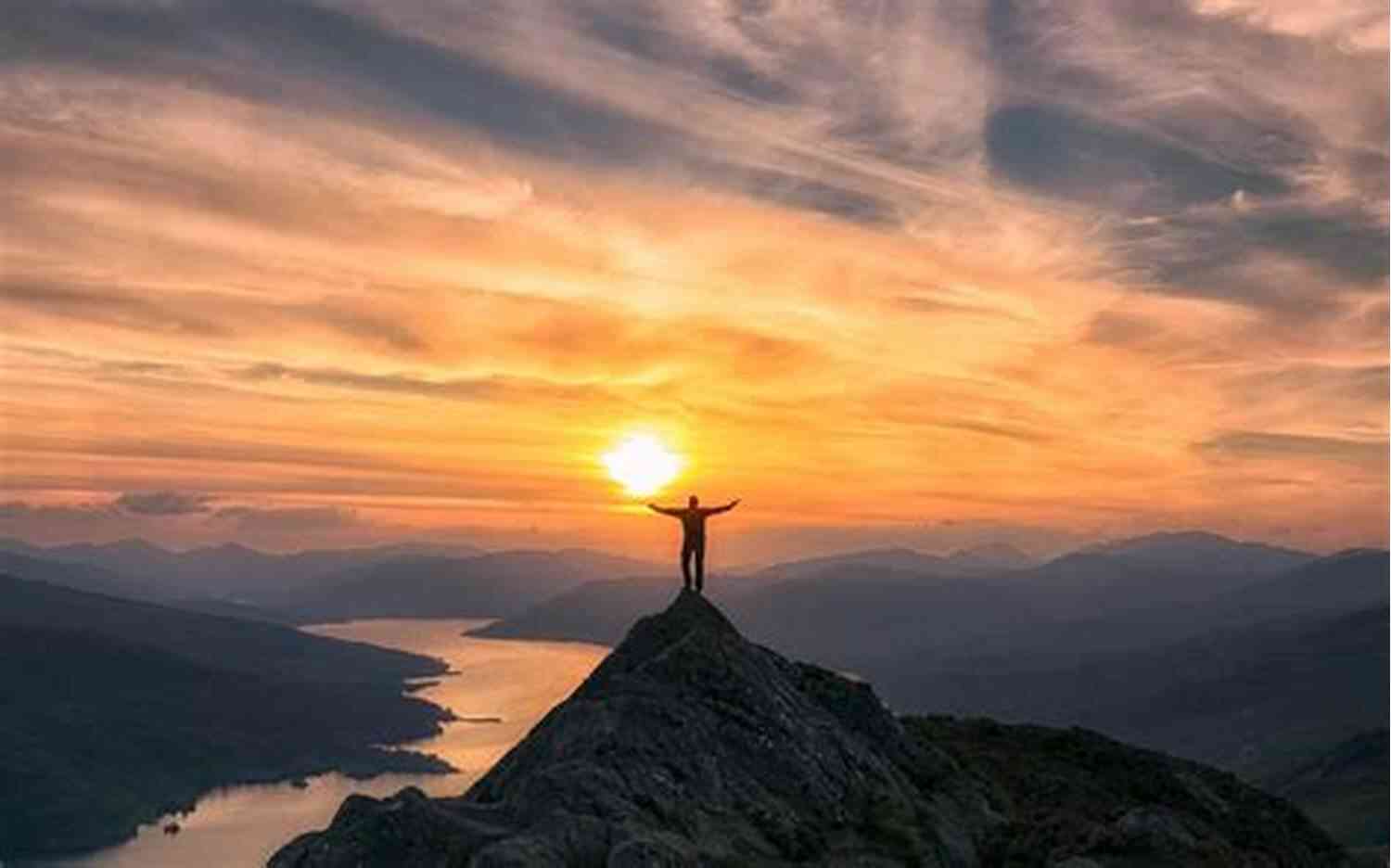 Person Standing On Top Of A Mountain, Embracing The Sunlight How To Not Die Alone: The Surprising Science That Will Help You Find Love
